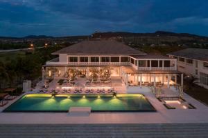 an aerial view of a house with a swimming pool at Azerai Ke Ga Bay in Ke Ga