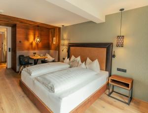 Postel nebo postele na pokoji v ubytování Ferienhotel Sonnenhof
