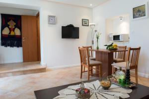 a living room with a table and a dining room at Apartment Ana in Dubrovnik