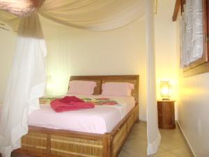 Posteľ alebo postele v izbe v ubytovaní Villa de 2 chambres avec vue sur la mer piscine privee et jardin clos a Deshaies