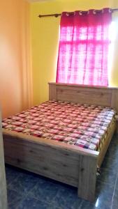Ένα ή περισσότερα κρεβάτια σε δωμάτιο στο 2 bedrooms house with furnished terrace and wifi at Fond du Sac 5 km away from the beach