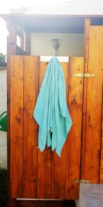a blue towel is hanging on a wooden locker at B&B Il Cortile del Sole in Olmedo
