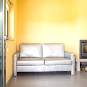 a white couch in a room with a tv at Comfortable Bungalow Pinhel, pool in Pinhel