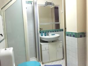 a bathroom with a sink and a mirror at One bedroom appartement at Mascali 10 m away from the beach with sea view furnished terrace and wifi in Mascali