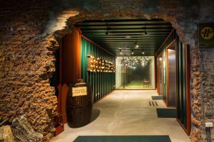an entrance to a wine cellar with a brick wall at Roaders Hotel - Zhonghua in Taipei