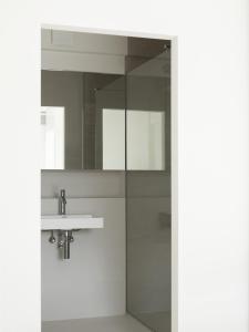 a bathroom with a sink and a shower at Modern & spacious apartment near beach in Knokke in Knokke-Heist
