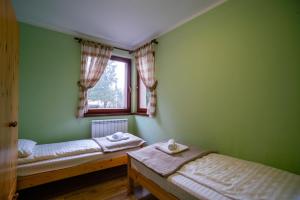 Cama o camas de una habitación en Apartments and Rooms Planinska Idila