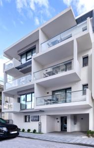 an apartment building with a car parked in front of it at δ193 in Volos