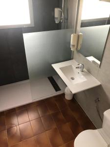 a bathroom with a sink and a toilet at Hotel Plaza Miami - Sólo Adultos in Miami Platja