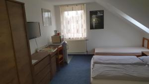 Postel nebo postele na pokoji v ubytování Veszprém Room