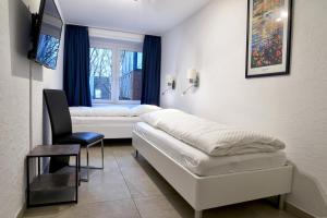 Ένα ή περισσότερα κρεβάτια σε δωμάτιο στο Nordland Appartements Wohnung Bornholm +13 φωτογραφίες