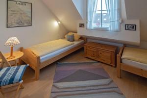 Postel nebo postele na pokoji v ubytování Haus am Siel