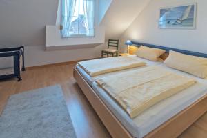 Postel nebo postele na pokoji v ubytování Haus am Siel