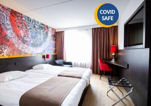 Postel nebo postele na pokoji v ubytování Bastion Hotel Maastricht Centrum