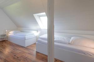 Tempat tidur dalam kamar di Deichblick