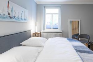 Postel nebo postele na pokoji v ubytování Mönkestübchen