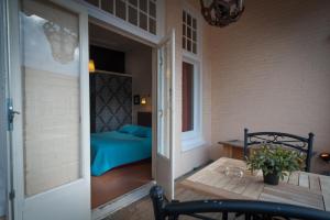 Postel nebo postele na pokoji v ubytování Hotel Grand Cafe Deight