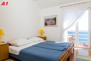 Postel nebo postele na pokoji v ubytování Apartments Mare