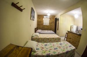 Een bed of bedden in een kamer bij Chalés Pipa