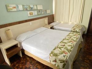 Postel nebo postele na pokoji v ubytování Hotel Pax