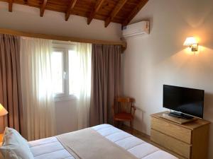 Un pat sau paturi într-o cameră la Hotel Soleado
