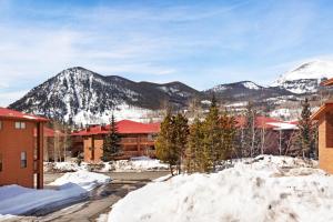 a resort in the snow with mountains in the background at Lagoon 737C in Frisco