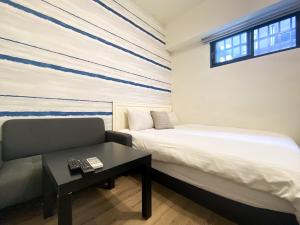 Llit o llits en una habitació de 梧桐樹