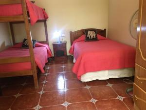 Postel nebo postele na pokoji v ubytování Hostal Puritama