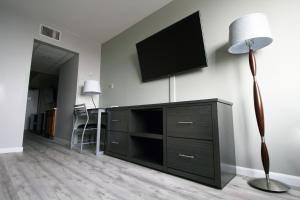 a living room with a flat screen tv on a wall at Bolero Resort in Wildwood