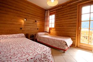 Cama o camas de una habitación en Appartement de 2 chambres avec jardin amenage et wifi a Chatel