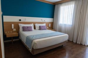 Letto o letti in una camera di Quality Faria Lima
