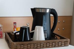 Set per la preparazione di tè e caffè presso Quality Faria Lima