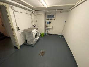 an empty hospital room with a washing machine in it at Tokis Feriendomizil 2.0 in Bad Säckingen