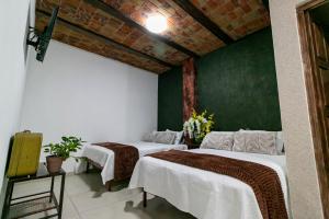 Postel nebo postele na pokoji v ubytování Casa De Rey