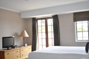Postel nebo postele na pokoji v ubytování City Suites