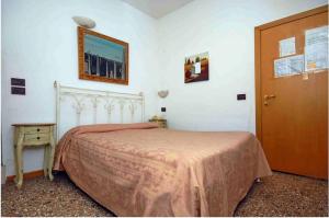 Postel nebo postele na pokoji v ubytování Hotel Antico Capon