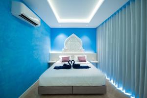 Postel nebo postele na pokoji v ubytování Le Maroc Hotel Patong + 37 fotografií