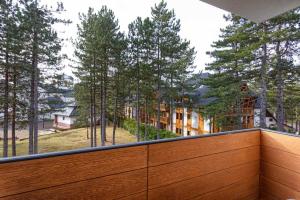 a view from the balcony of a house with trees at Dejana Apartment in Zlatibor