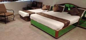Letto o letti in una camera di Hotel JMC Group