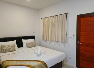 Postel nebo postele na pokoji v ubytování Vamin Resort Chiangkhan Loei วามินทร์รีสอร์ท เชียงคาน เลย + 16 fotografií