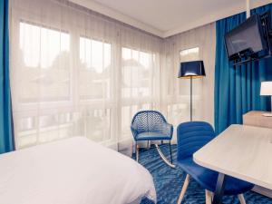 Postel nebo postele na pokoji v ubytování Mercure Lenzburg Krone + 37 fotografií