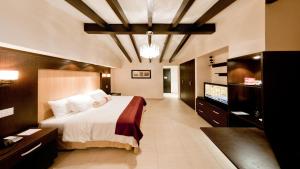 a bedroom with a bed and a flat screen tv at The Beach House in Panama City +27 photos