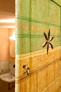 a wooden door with a star on the wall at Palazzo Uguccioni Apartments in Florence