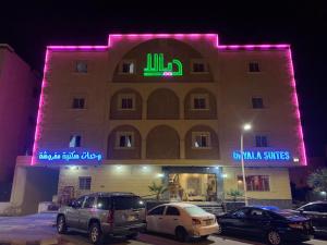 a building with cars parked in front of it at ديالا للشقق المخدومة1 in Riyadh