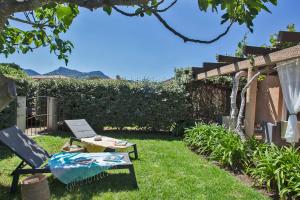 Zahrada ubytování maison kiwi avec piscine chauffée terrasse jardin et bbq à Calvi + 13 fotografií