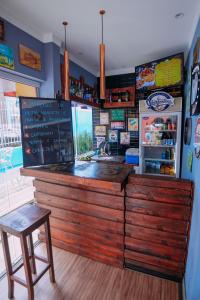 a bar in a restaurant with a counter and a stool at Bonabrigo Hostel & Suítes in Balneário Camboriú +62 photos