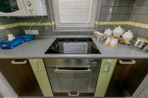 Kuchyň nebo kuchyňský kout v ubytování Olive Garden Apartment + 37 fotografií