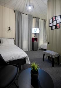 Postel nebo postele na pokoji v ubytování RUMI Hotel with Self Check-In