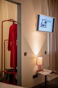 TV a/nebo společenská místnost v ubytování RUMI Hotel with Self Check-In