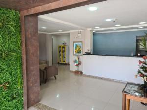 a lobby with a reception desk in a hospital at Hotel Jardim do Mar in Torres +52 photos